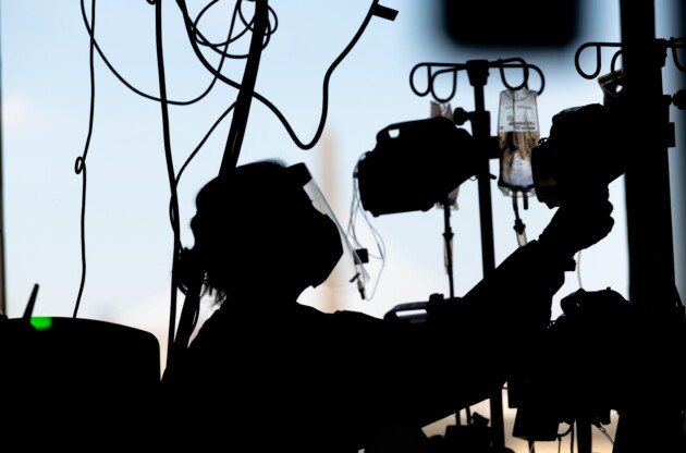 silhouette of a woman in a mask.